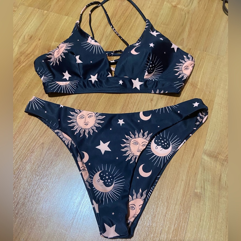 Black and peach bikini bathing suit. Sun, moon, stars.Size 8